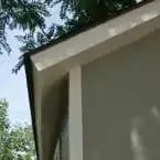 Installed Meridian 8 ft. x 10 ft. Wood Storage Shed with Autumn Brown Shingles image 4